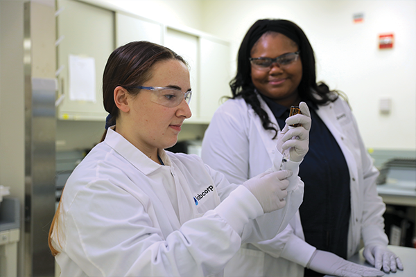 Two Labcorp scientists working inside of a lab