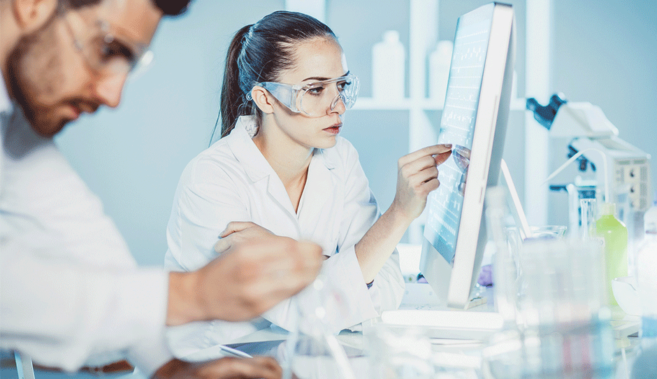 Two scientists observing a computer